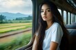 © SachiDesigns - young pretty woman traveling train sitting near the window travel
