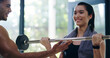© peopleimages.com - Fitness, smile or weightlifting with personal trainer and woman in gym for strength training. Muscle, power or workout with coach and happy person in health club for concentration or challenge
