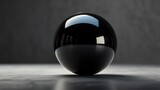 a black glass sphere with the word blue on it.