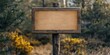 © Ahmad - A wooden sign mounted on a post featuring an empty area where you can write a personal message or an invitation.