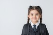 © Chaikit - 2408_008.Cute little Indian schoolgirl in uniform looking at camera with backpack while standing on white background