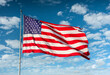 © Cavan Images - American flag blowing in the wind