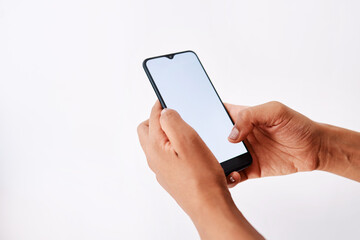 Poster - Person, hands and typing with phone screen for communication or social media on a white studio background. Closeup, model or user with mobile smartphone display for online chat, app or mockup space