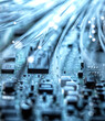 © Westend61 - Blue fiber optics wires transferring data into computer hardware