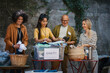 © Westend61 - People sorting donated used clothes for charity