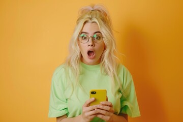Poster - A woman stands holding a cell phone, wearing a green shirt