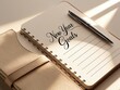 © vilaiporn - An elegant notebook with 'New Year Goals' written, symbolizing new beginnings and personal growth.