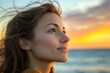 © Ева Поликарпова - A woman with long hair standing on the beach at sunset, great for travel or lifestyle shots