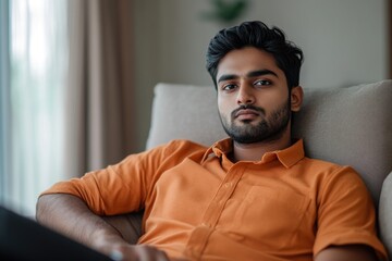 Poster - A person sitting at a desk with a laptop, suitable for work or study purposes