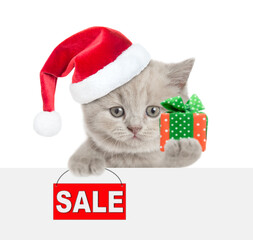 Aufkleber - Cute tiny cat holding gift box above blank white banner and showing signboard with labeled 