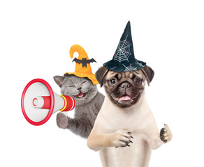 Aufkleber - Happy cat and Pug puppy wearing  hats for halloween looks at camera. Dog showing thumbs up gesture. Kitten meowing into the megaphone. isolated on white background