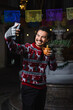 © Marcos - Mexican man at traditional posada party for Christmas celebration in Mexico Latin America, holidays and Christmas eve