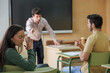 © Paula - Angry boss scolding a female worker with his coworker. Teacher scolding a student because she was cheating on the exam.