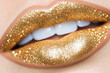 © romanets_v - Shimmering gold glitter lips close-up with glamorous sparkle in a modern makeup style