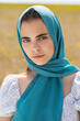 © Andrey_Arkusha - Close up portrait of a young woman in a traditional patterned headscarf