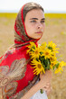 © Andrey_Arkusha - Close up portrait of a young woman in a traditional patterned headscarf