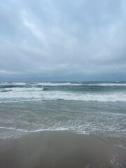 Wall Mural - stormy cloudy seascape, waves at the sea, rainy clouds