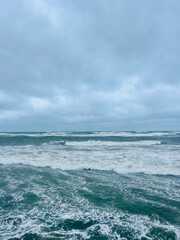 Wall Mural - stormy cloudy seascape, waves at the sea, rainy clouds