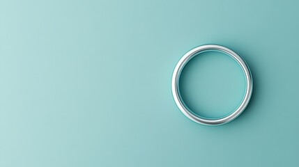 Poster - A simple circle on a turquoise background, showcasing minimalism and elegance.