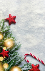 Wall Mural - Christmas background with red decorations on white snow background. Top view.