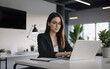 © itakdalee - woman working with a laptop in a modern office, freelancer, businesswoman at work