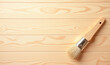 © Radorog. - a brush on a brown wooden background, copy space