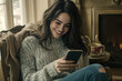 © MashMash - Cozy Winter Moments - Woman Enjoying Relaxed Time with Smartphone Indoors, Warm Sweater, Comfort and Relaxation, Social Media, and Digital Connection