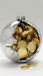 © muniba - A silver Christmas ball cracked open, revealing golden coins.