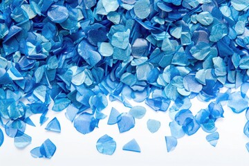 Poster - A collection of blue glass shards scattered on a white surface