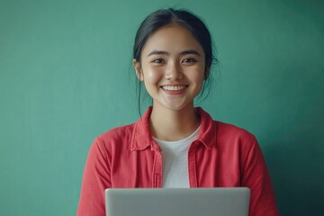 Poster - A happy woman looks at her laptop with a smile