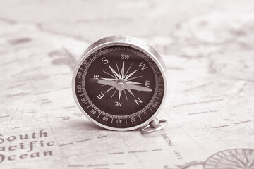 Wall Mural - classic round compass on background of old vintage map of world