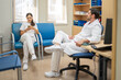 © Santi Nuñez/Stocksy - Medical staff taking a break in hospital office
