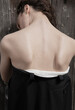 © STUDIO HAMZA/Stocksy - Arty photo of a model showing her back