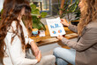 © Alvaro Lavin/Stocksy - Businesswomen having meeting while drinking coffee