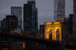 © VICTOR TORRES/Stocksy - Illuminated Brooklyn Bridge against New York City skyscrapers at night