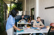© Pedro Merino/Stocksy - Woman arriving at a coworking space