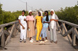 © Alvaro Lavin/Stocksy - Five young senegalese women posing on a wooden bridge