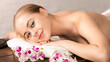 © Prostock-studio - Body care. Spa massage for smiling millennial woman