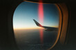 © Sean Flanigan/Stocksy - light leak frame an airplane