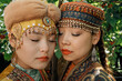 © Azamat Mukanov/Stocksy - Portrait of two beautiful women in traditional clothing