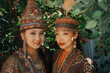© Azamat Mukanov/Stocksy - Portrait of two beautiful women in traditional clothing