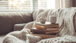 © wikanda - A cozy reading corner with a stack of wellness and mindfulness books, a cup of tea, and a soft blanket