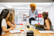 © koganami studio/Stocksy - Team leader presenting ideas in a business meeting