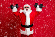 © deagreez - Photo of pensioner old mad man white beard lift dumbbells open mouth screaming heavy weight ignoring muscle pain wear santa x-mas costume sunglass cap isolated red color background