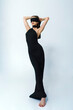 © Александр Иванов - young woman in a long black evening dress blindfolded, the mystery and mystery of a woman