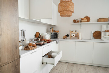 Wall Mural - Interior of modern kitchen with counters, cupboards and utensils