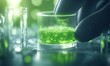 © AhmadTriwahyuutomo - A hand adds a glowing green substance to a glass container, surrounded by test tubes, in a vibrant laboratory setting.