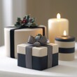 © Big9869 - A wrapped gift box with a black and grey ribbon sits in front of two candles and a larger wrapped box with a holly sprig on top.