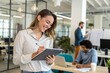 © NISHAN'S STUDIO - Reading and woman in office with tablet, schedule or creative developer at digital agency. Planning, happy designer or consultant at tech startup with notes, agenda or admin in coworking space