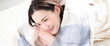 © kapinon - Banner with image of a woman relaxing face down in a warm room in autumn/winter Overhead view of a room